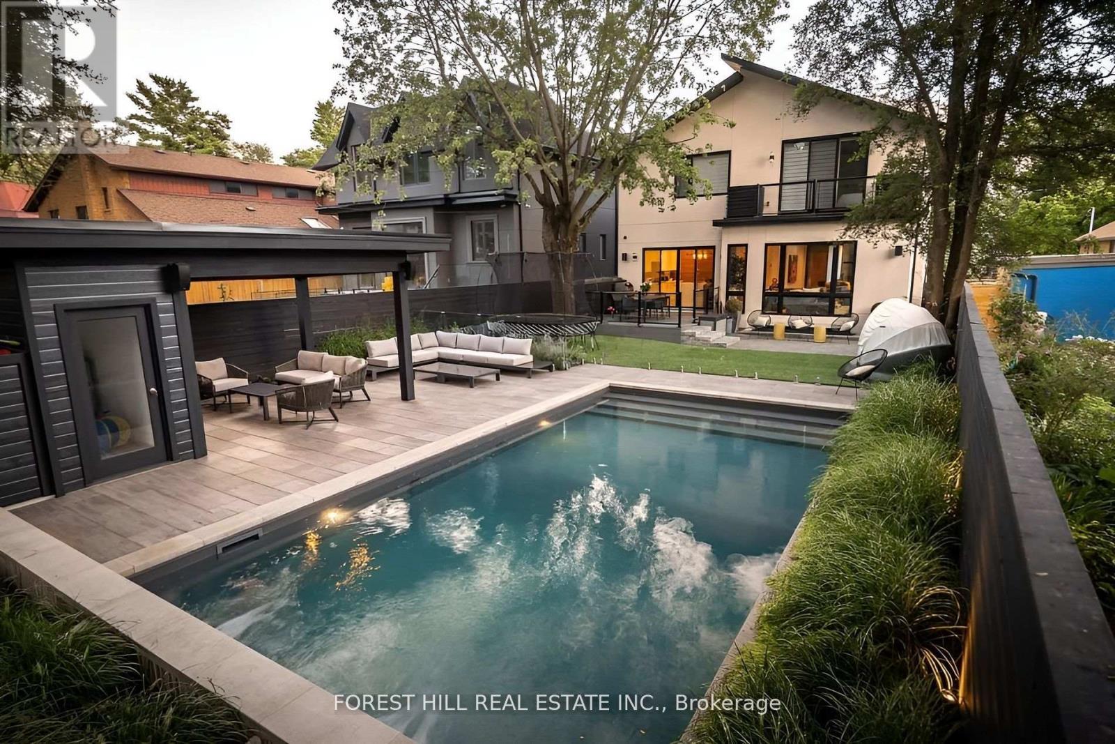 Architectural Showpiece for Sale in Etobicoke Move-In Ready Luxury View the award-winning backyard: executiveagency.ca/8NoraRoad. A rare opportunity to own an extraordinary custom home on a quiet, tree-lined street in the heart of Etobicoke. Offering approx.4,600 sq. ft. of impeccably designed living space, this contemporary masterpiece is defined by timeless elegance, high-end craftsmanship, and thoughtful details throughout. The main level features a sun-drenched open-concept layout with oversized picture windows, a chefs kitchen with premium appliances and a large island, formal dining, a striking natural stone gas fireplace, powder room, main floor den, and a welcoming foyer designed for elevated living and effortless entertaining. Upstairs, a skylit hallway leads to a serene primary suite with a walk-in closet, spa like ensuite with heated floors, and a private balcony overlooking the backyard. Each additional bedroom offers its own ensuite bath and walk-in closet, with one also enjoying private balcony access. Upper-level laundry and linen storage add everyday ease. The finished lower level is a true extension of the home, with heated floors throughout, a spacious family/recreation area, an additional bedroom and full bath ideal for guests or a nanny suite plus a second laundry room. Outside, enjoy a professionally landscaped backyard oasis with a salt water pool, cabana, dining zone, and multiple lounge areas perfect for summer entertaining. Located steps to Islington Village, Kipling Station, top-rated schools, and only minutes to downtown and Pearson Airport. A statement home that delivers on luxury, lifestyle, and location. Book your private showing today. (id:48254)