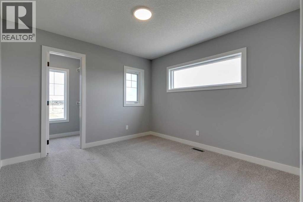 23 Creekstone Green Sw, Calgary, Alberta  T2X 5W4 - Photo 31 - A2216897
