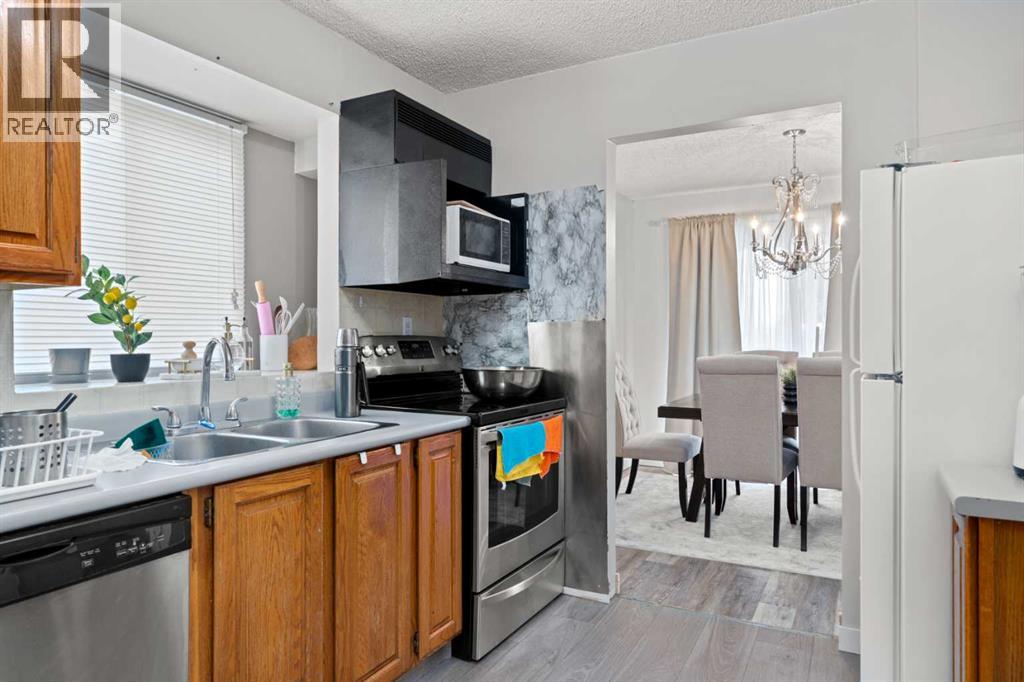 7827 Hunterquay Road Nw, Calgary, Alberta  T2K 4T8 - Photo 6 - A2263143