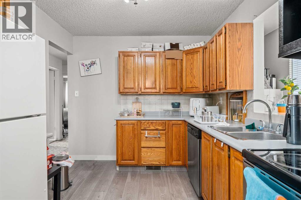 7827 Hunterquay Road Nw, Calgary, Alberta  T2K 4T8 - Photo 7 - A2263143