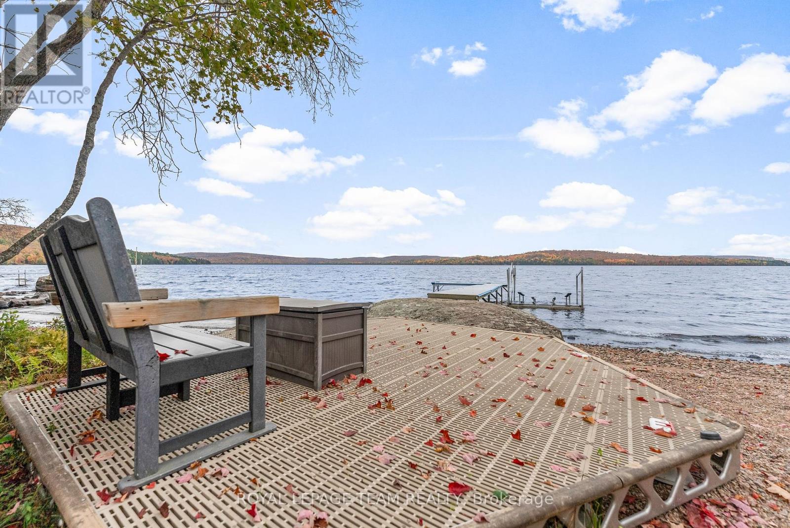 Wow it doesn't get any better than this, 187 feet of water front on beautiful sought after Bark Lake. Enjoy all that Bark Lake has to offer with its excellent fishing, boating, swimming , kayaking and much more. Spend your evenings sitting on the dock enjoying some of the most spectacular sunsets you will ever see. The home is a fairly new build featuring 3 good size  bedrooms on the main level with a large open concept kitchen, dining room and living room. Enjoy the stunning lake views from large sliding glass doors which lead to a spacious deck. The living room has a wood stove to curl up to on those chilly nights. The upper level loft area is wide open and can serve as a family room , games room, or hobby room or extra sleeping quarters.  The basement is a 5 foot dry crawl  space for all your storage and utilities.  The area is famous for its snowmobile and ATV trails. Barry's Bay is just a 15 minute drive and the town has two grocery stores, pharmacy, post office, shops and even has its own St Francis Hospital. Algonquin Park is just a short drive away. Homes on Bark Lake don't come up for sale very often. Please allow 24 hour irrevocable on all offers. (id:48254)