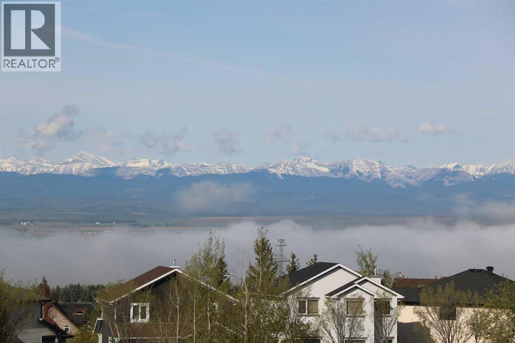 117 Rockcliff Bay Nw, Calgary, Alberta  T3G 5Z5 - Photo 3 - A2222296