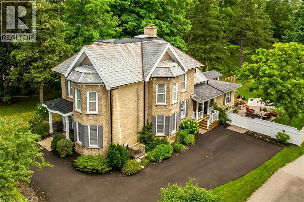 Fully restored Victorian beauty, circa 1885, on a 1.3-acre piece of paradise that stretches 932’ to the banks of the Grand River in Paris.  The current owners, over the last three decades, have extensively updated this 2758 sq.ft. home with a perfect blend of modern convenience and historical integrity… custom kitchen, luxurious renovated bathrooms, updated mechanicals, windows, and much more. Its front and side two-storey bays, decorative front entrance, roof brackets, radius arches over the windows, and slate roof with new copper trim, remain true to the heritage district in which it is located. The spectacular staircase, high ceilings, and spacious rooms capture the elegance of a bygone era, while the carefully restored and detailed trim and mouldings, medallions, and doors, bear witness to a level of craftmanship that has stood the test of time. With a large family room addition on the main floor, four bedrooms, two full baths and one 2-pce bath, this home offers space and comfort for family living. An easy walk takes you to Paris’ pretty downtown at the junction of the Grand and Nith Rivers, with its excellent restaurants and shopping.  Schools are within easy walking distance, minutes to highways 403 and 401, this property will impress you, surrounded by the best of small-town Ontario. (id:48254)