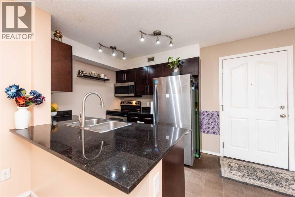 215, 7210 80 Avenue Ne, Calgary, Alberta  T3J 0N7 - Photo 4 - A2252497