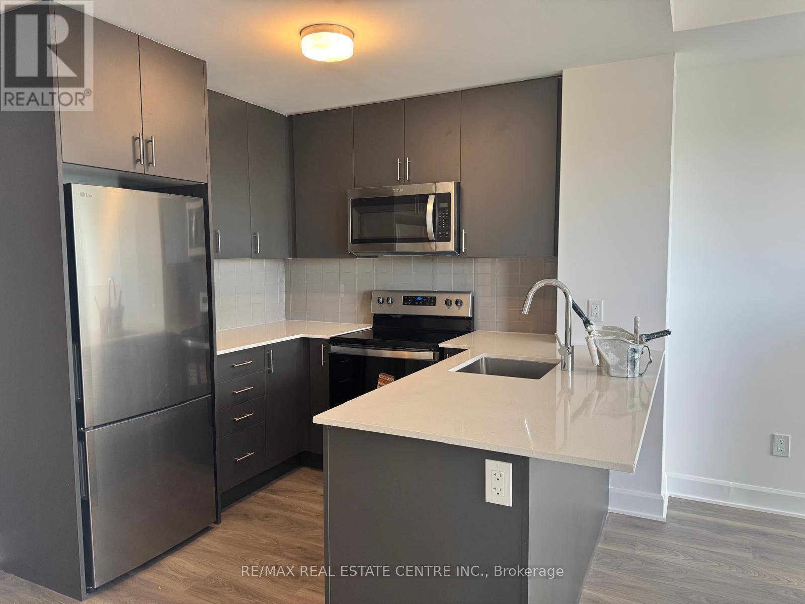 1211 - 3240 William Coltson Avenue, Oakville, Ontario  L6H 8C8 - Photo 11 - W12456160
