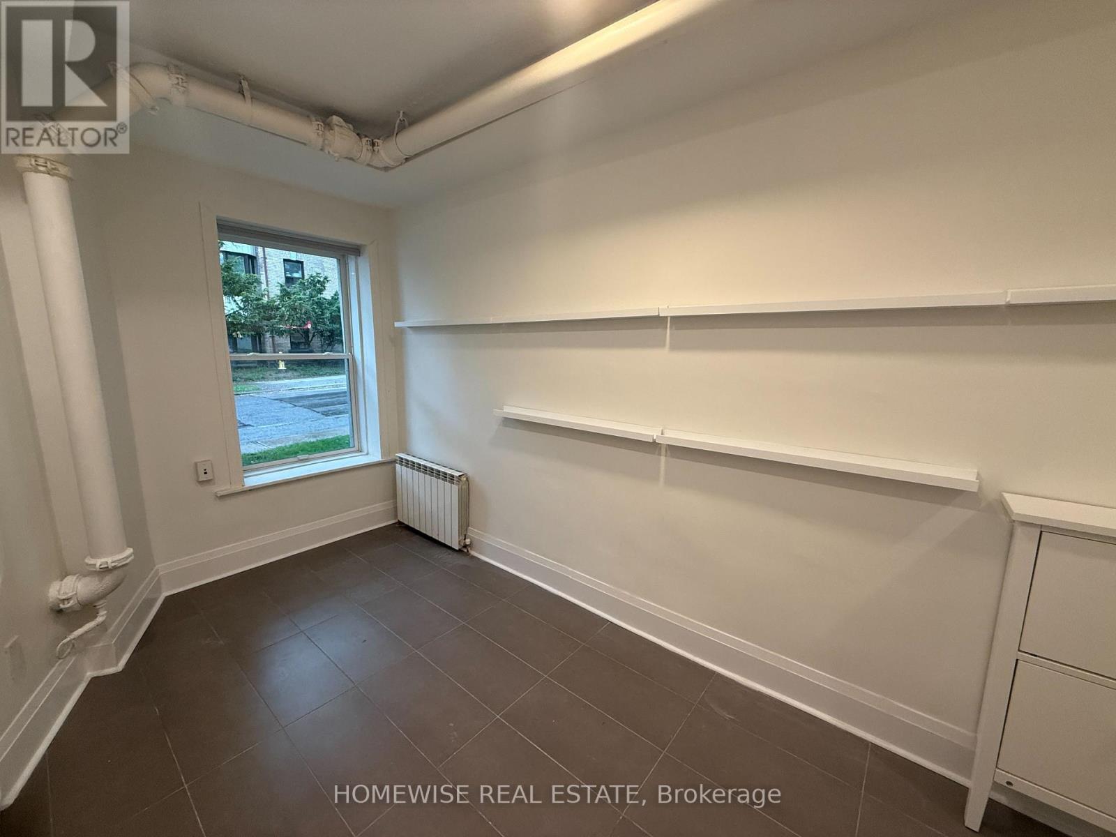 105 - 1 Triller Avenue, Toronto, Ontario  M6K 3B7 - Photo 3 - W12457041