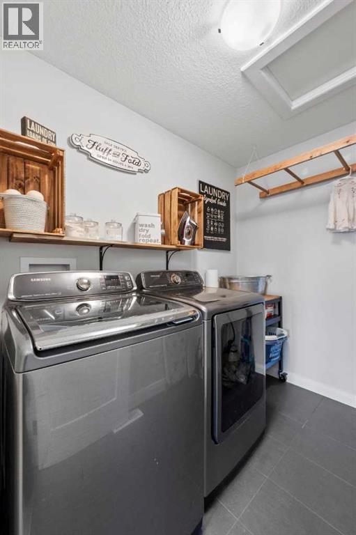 136 Kinniburgh Drive, Chestermere, Alberta  T1X 0T8 - Photo 31 - A2232363