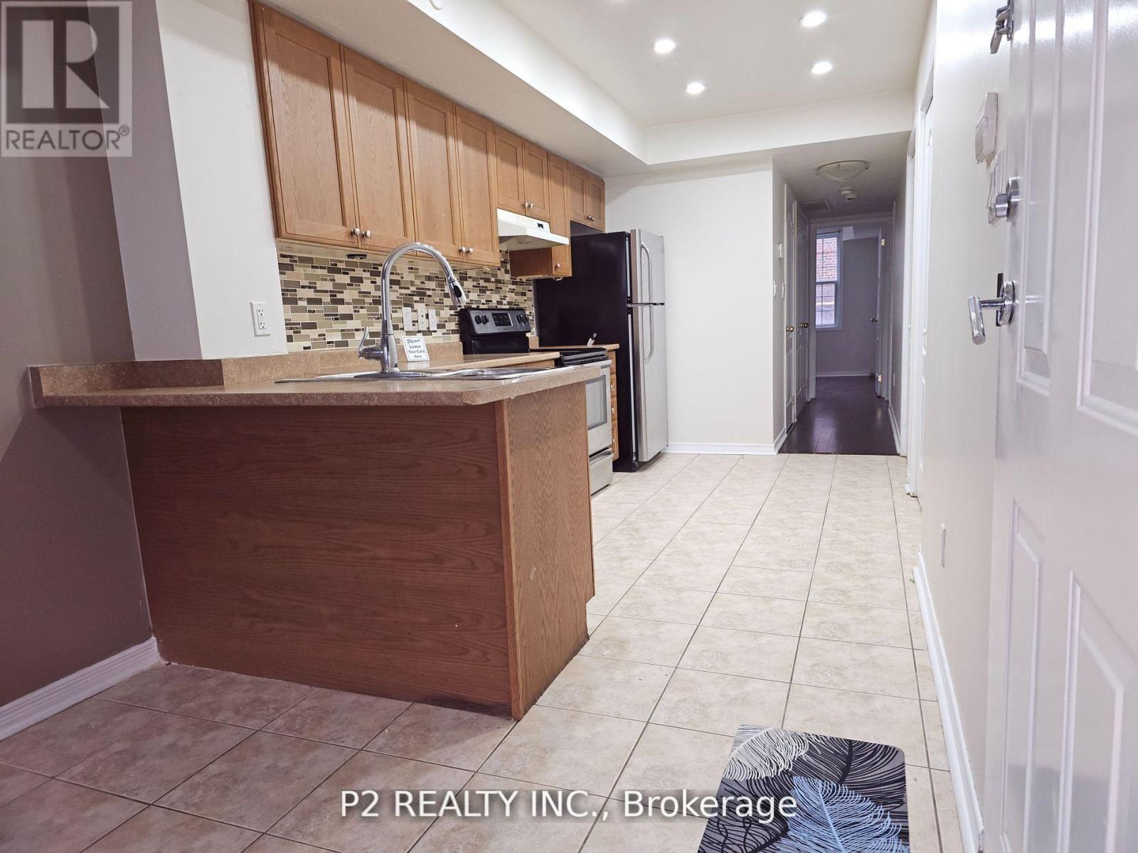 202 - 45 Strangford Lane, Toronto, Ontario  M1L 0E5 - Photo 3 - E12458153