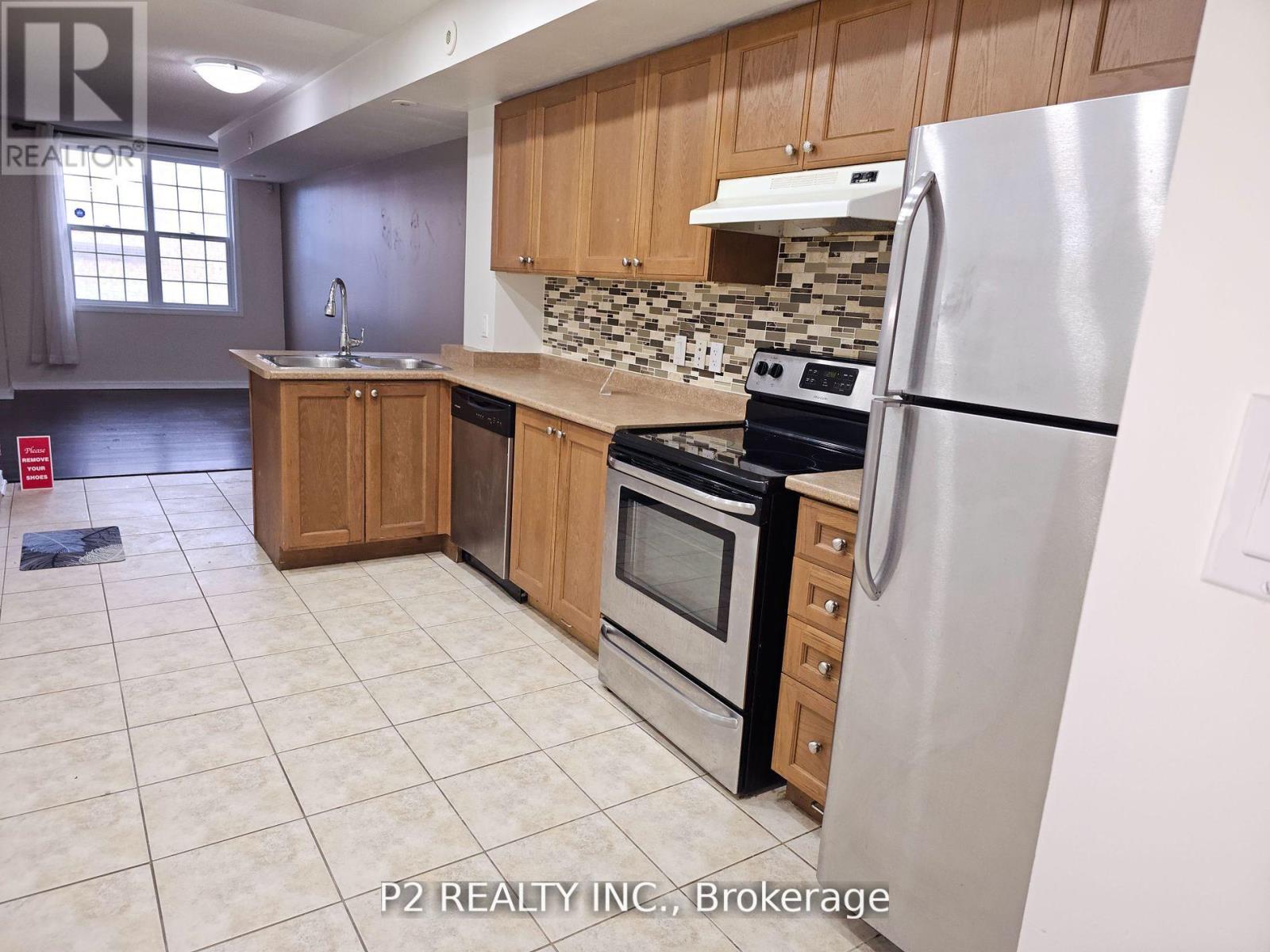 202 - 45 Strangford Lane, Toronto, Ontario  M1L 0E5 - Photo 4 - E12458153