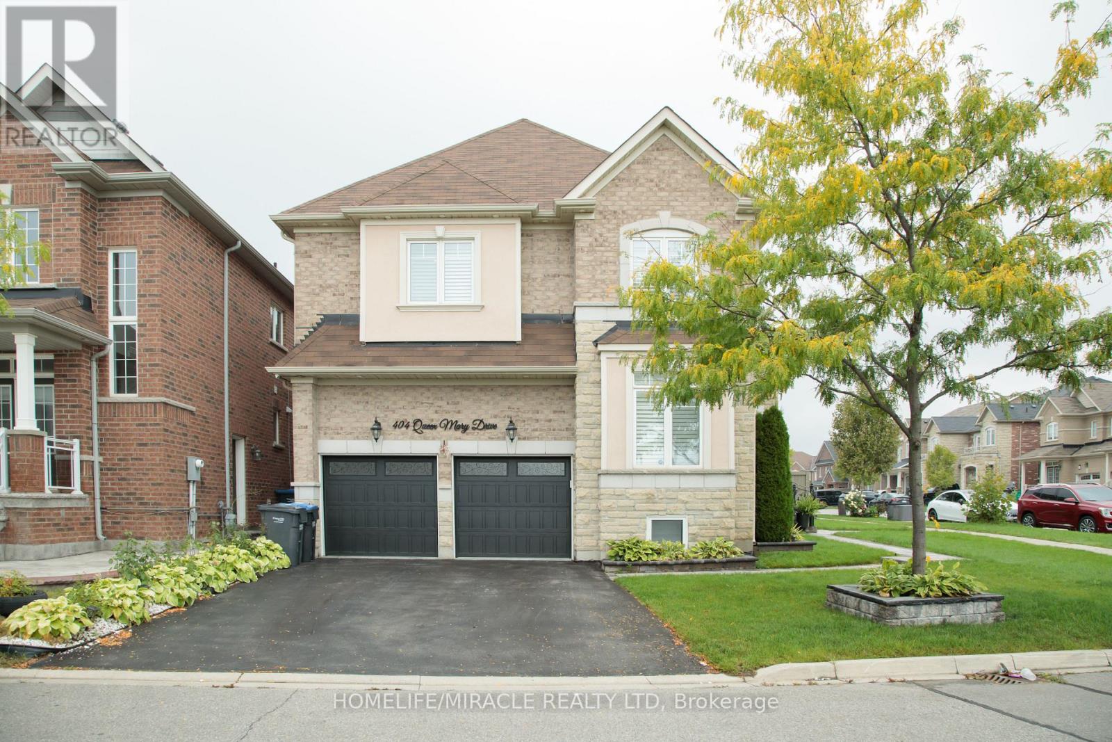 404 Queen Mary Drive, Brampton, Ontario  L7A 4K4 - Photo 2 - W12458377