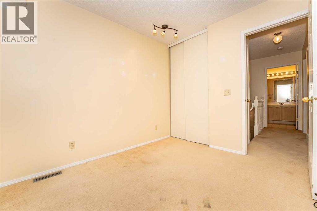 215 Coachway Lane Sw, Calgary, Alberta  T3H 2V9 - Photo 32 - A2262406