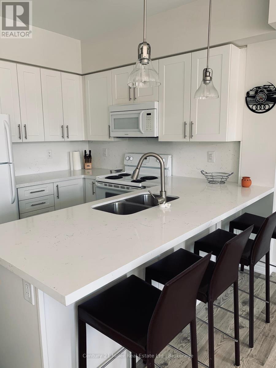 306 - 2326 Taunton Road, Oakville, Ontario  L6H 0L3 - Photo 1 - W12460010