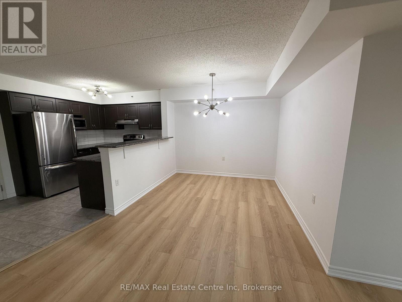 306 - 1440 Main Street E, Milton, Ontario  L9T 0R3 - Photo 2 - W12461687