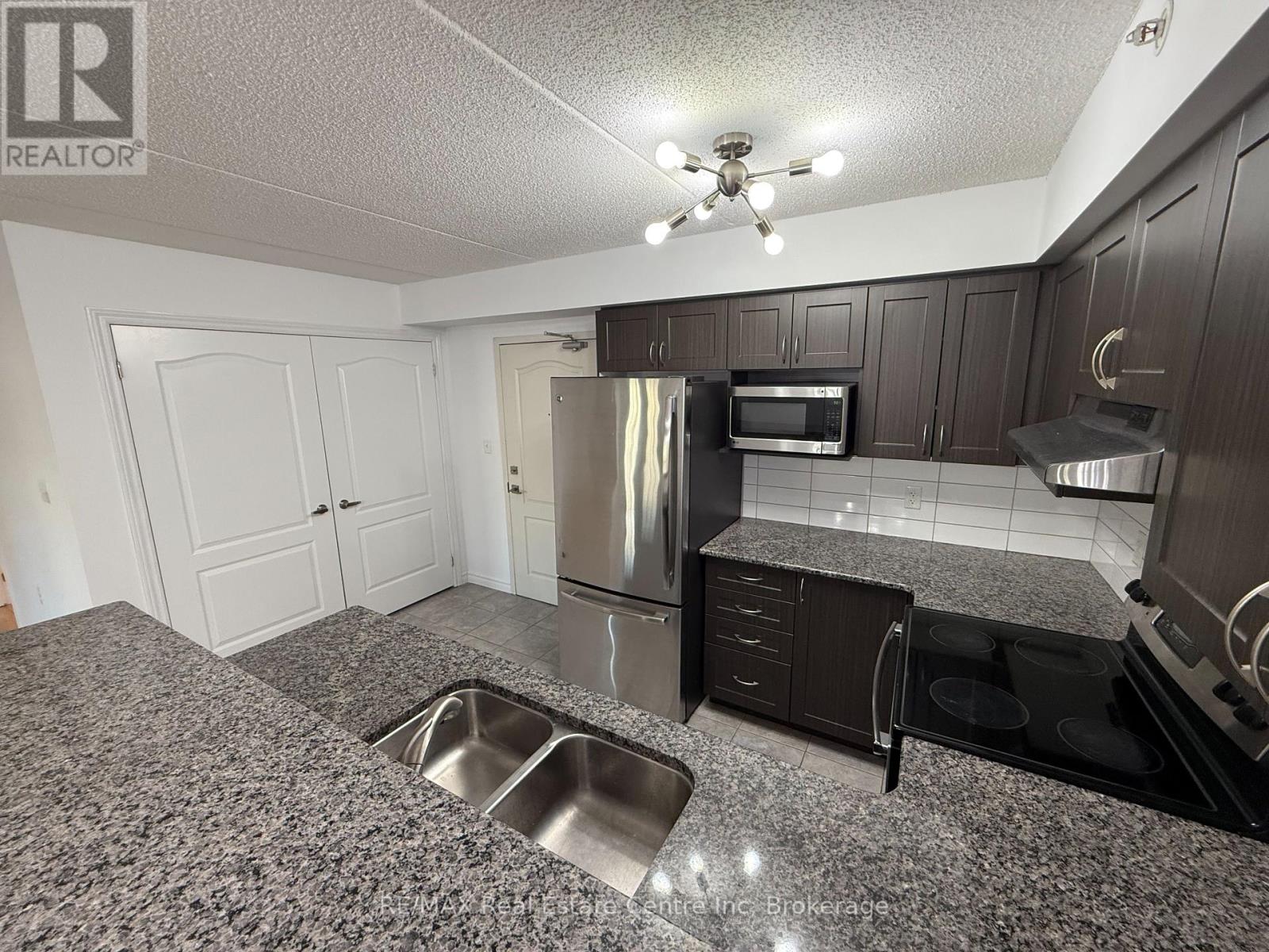 306 - 1440 Main Street E, Milton, Ontario  L9T 0R3 - Photo 3 - W12461687
