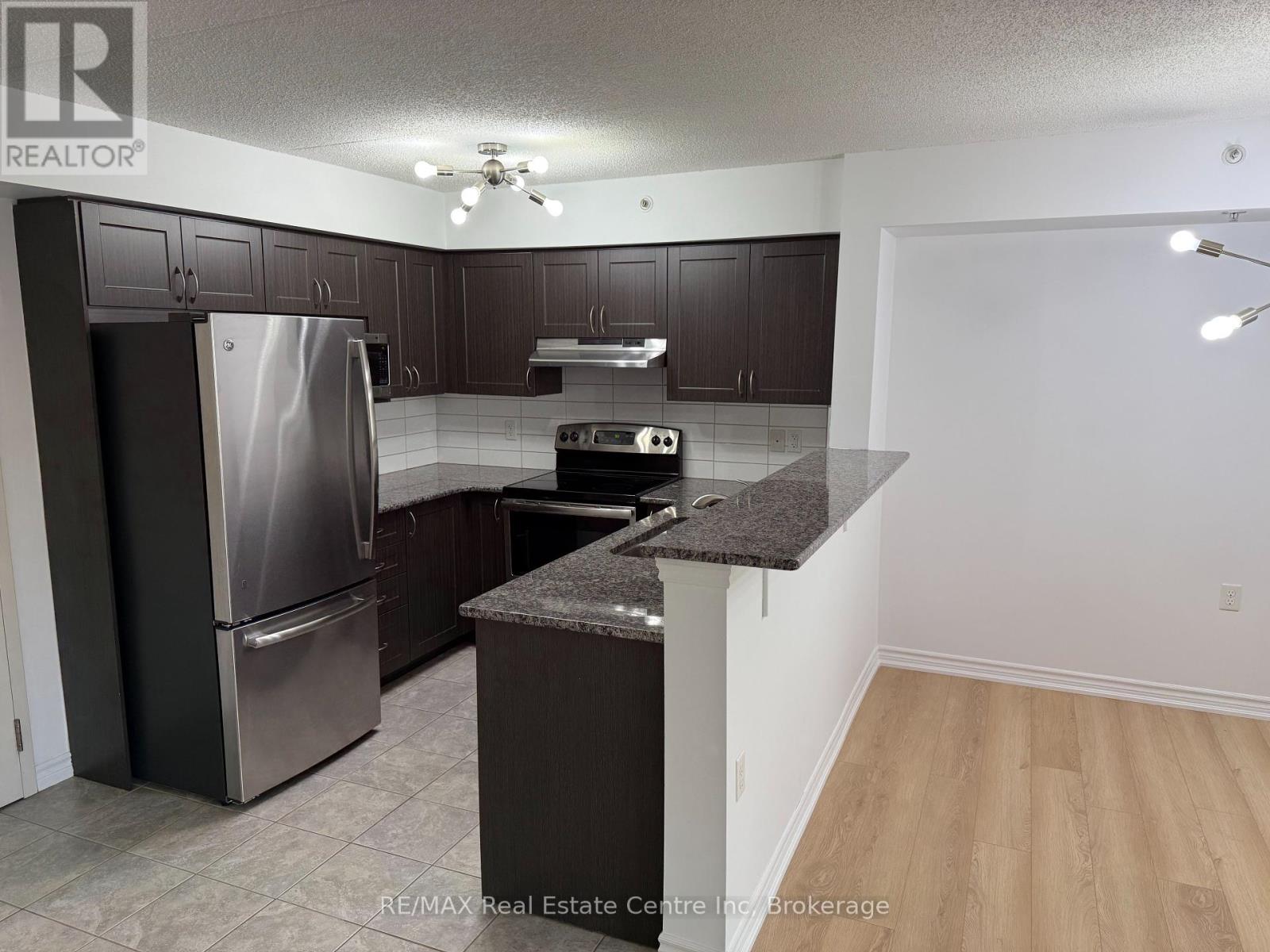 306 - 1440 Main Street E, Milton, Ontario  L9T 0R3 - Photo 4 - W12461687