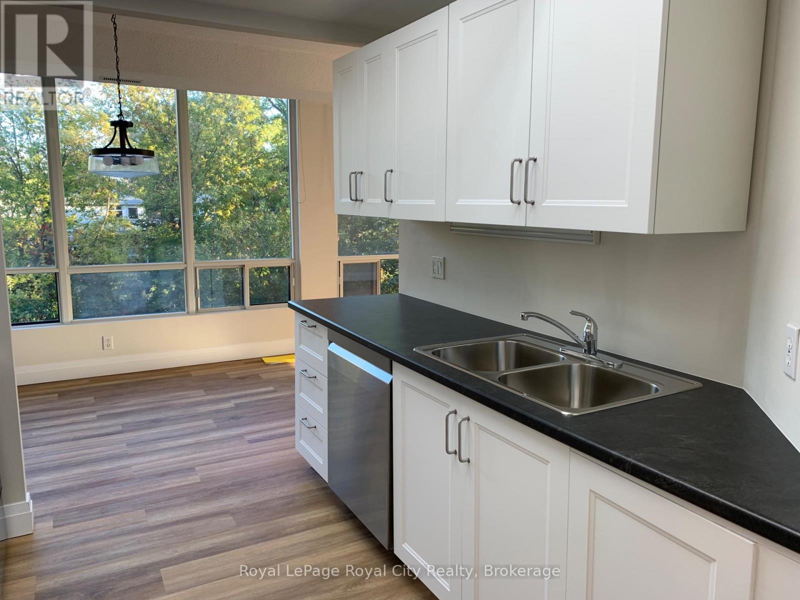 301 - 105 Bagot Street, Guelph, Ontario  N1H 8H4 - Photo 3 - X12462154