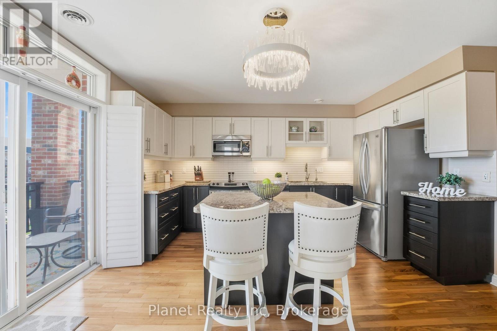 308 - 65 Bayberry Drive, Guelph, Ontario  N1G 5K8 - Photo 2 - X12463061