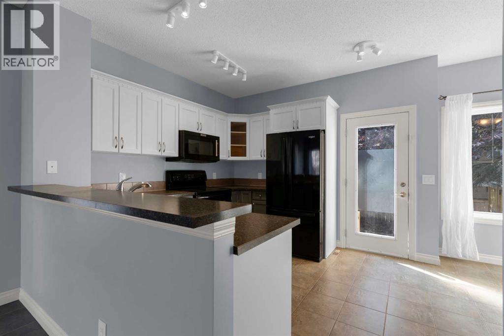 211 Strathaven Mews, Strathmore, Alberta  T1P 1P4 - Photo 6 - A2248839