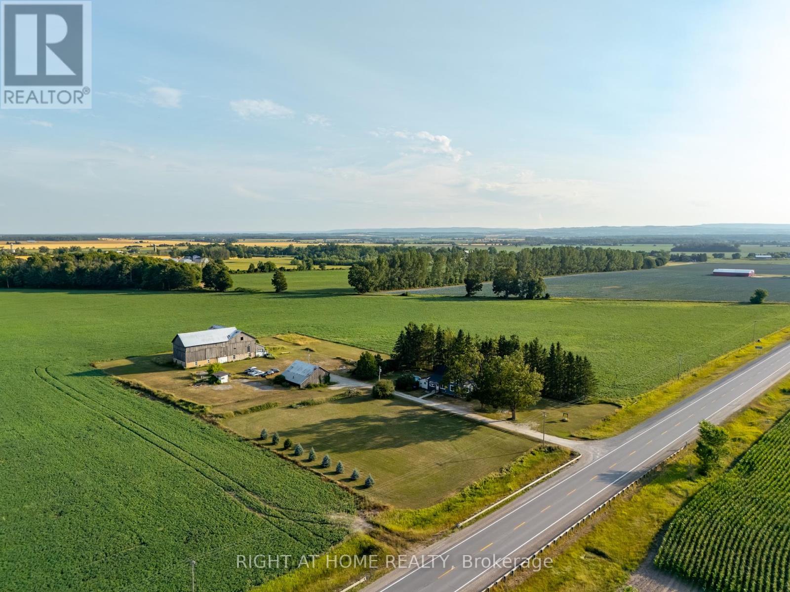 Welcome to your opportunity to live more intentionally on over 3 peaceful acres, just minutes from Wasaga Beach. This beautiful Century Home blends charm, space, and lifestyle flexibility. Ideal for those dreaming of a hobby farm, home-based business, or simply more room to grow. The property features a large barn (approx. 67 x 36 x 86), a detached workshop/garage (approx. 35 x 40 with 220V outlet ), multiple outbuildings, and an above-ground pool; Offering endless potential for future projects. Inside, the home combines character with comfort, offering 4 bedrooms, 2 bathrooms, a large foyer, and a cozy sitting room with a fireplace and brick accents. The updated kitchen is both stylish and functional, while the oversized upstairs bedroom provides space for a home office, studio, or private retreat. Located minutes to schools, shops, and amenities -- this property offers rural tranquility with urban convenience. (id:48254)