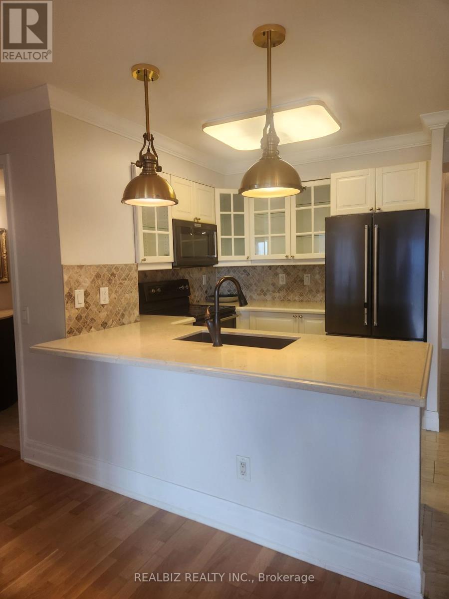 2221 - 25 Kingsbridge Garden Circle, Mississauga, Ontario  L5R 4B1 - Photo 2 - W12464952