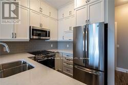624 - 102 Grovewood Commons Crescent, Oakville, Ontario  L6H 0X2 - Photo 3 - W12468298