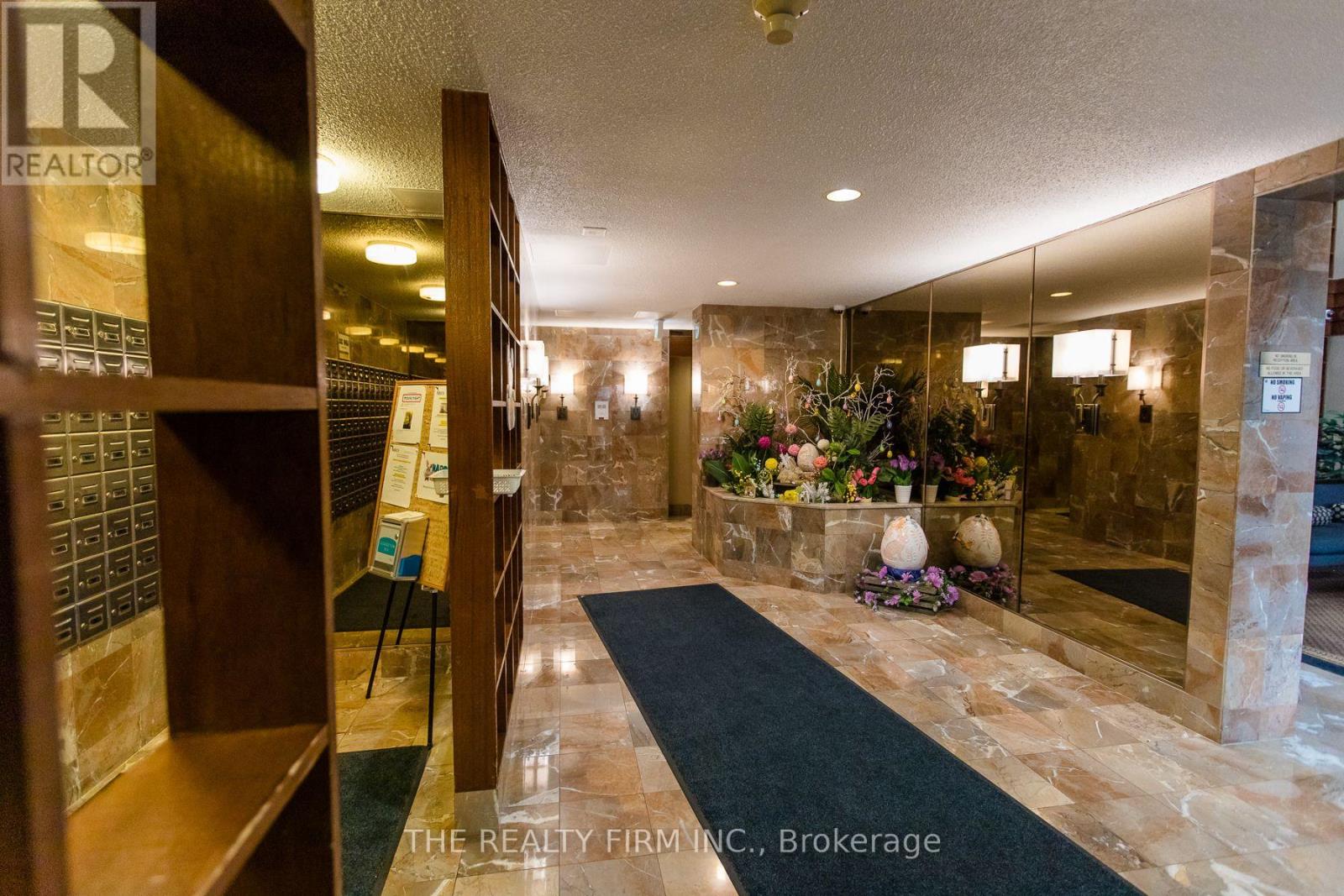 406 - 100 County Court Boulevard, Brampton, Ontario  L6W 3X1 - Photo 3 - W12469063