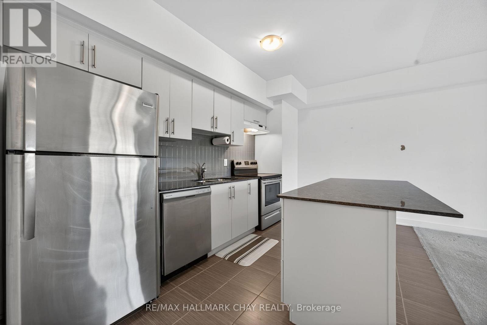 104 - 6 Spice Way, Barrie, Ontario  L9J 0J9 - Photo 4 - S12469214