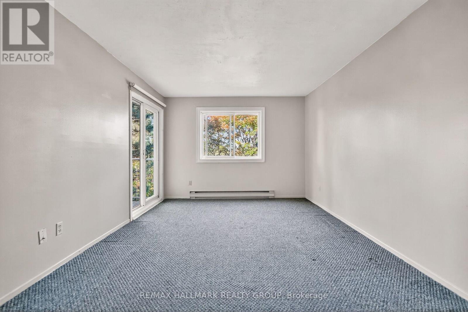 306 - 270 Brittany Drive, Ottawa, Ontario  K1K 4M3 - Photo 2 - X12469432