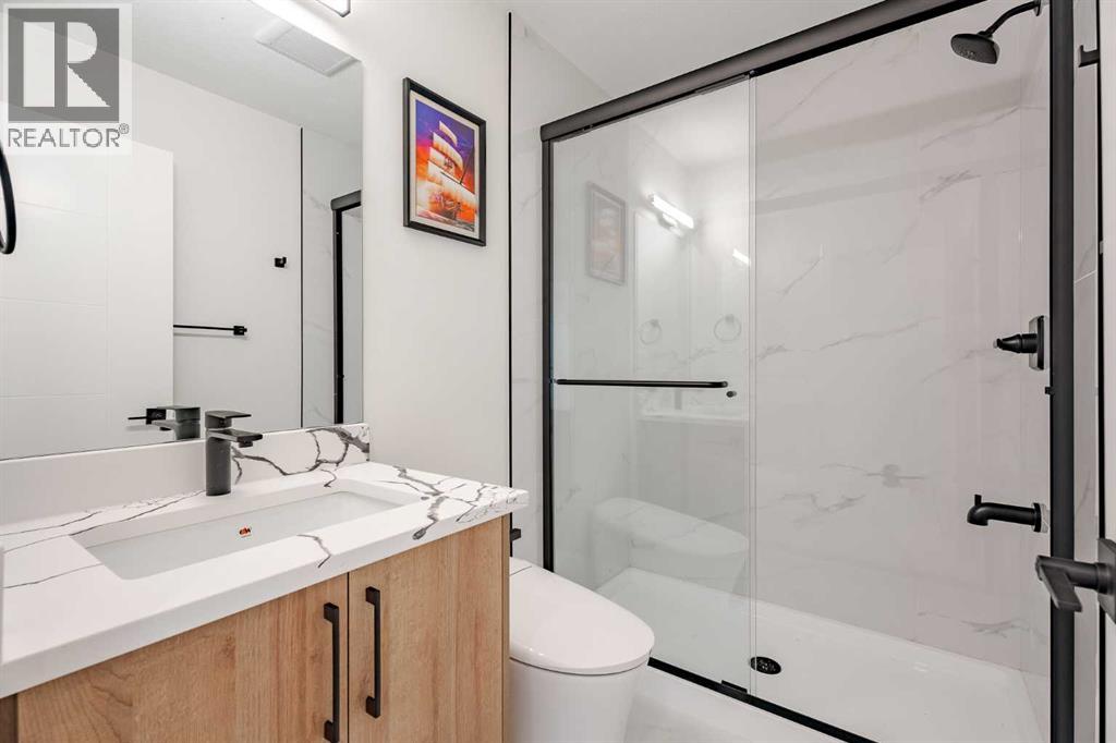 7020 Huntbourne Road Ne, Calgary, Alberta  T2K 3X7 - Photo 26 - A2262031