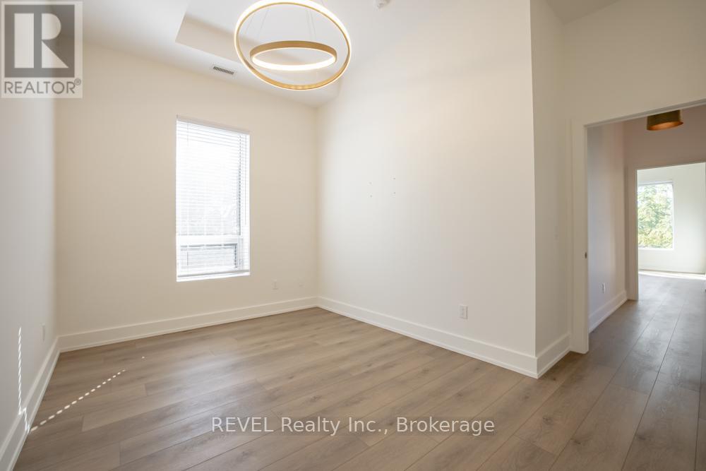 405 - 77 Yates Street, St. Catharines, Ontario  L2R 5R7 - Photo 18 - X12471534