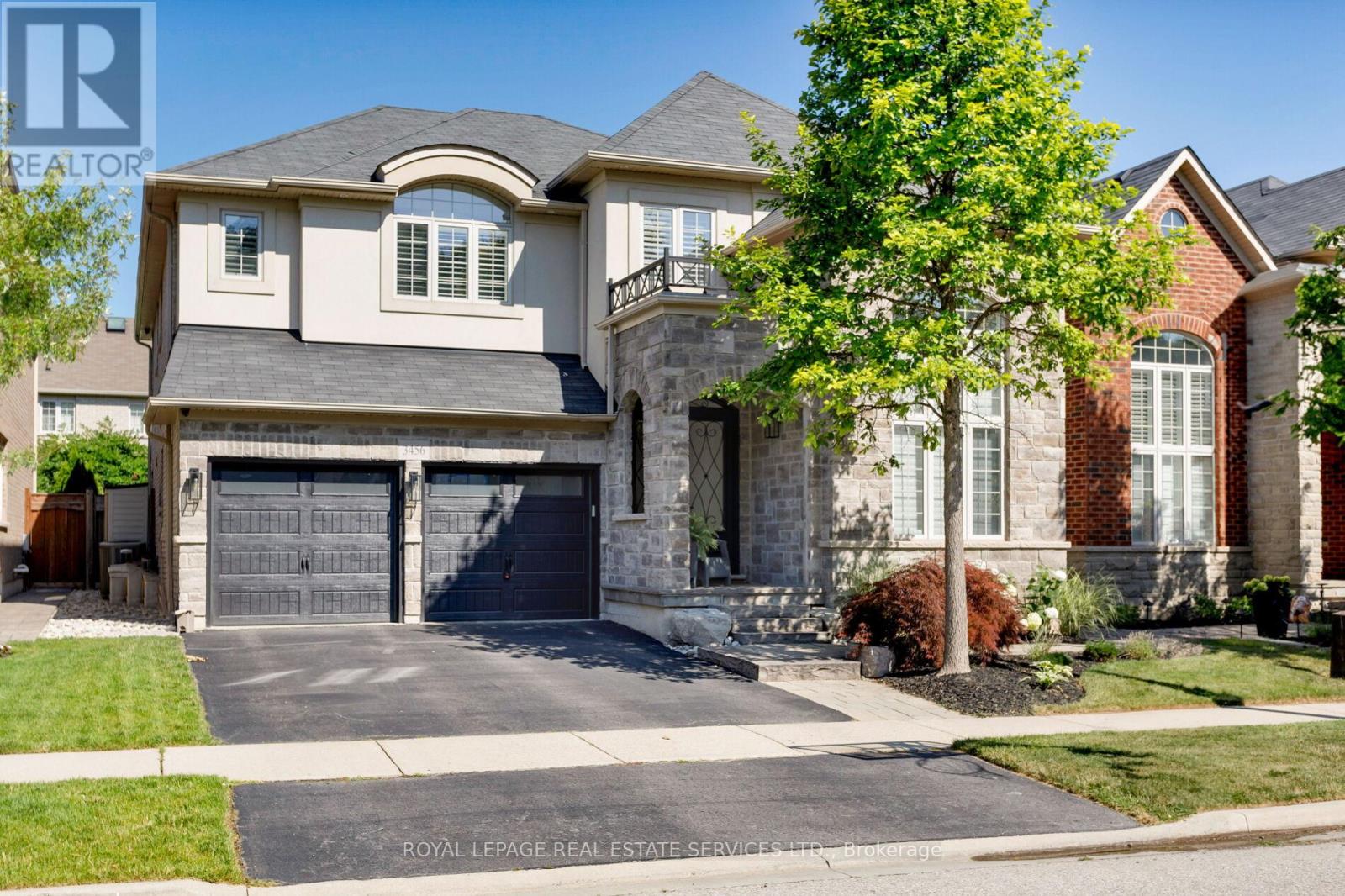 Discover luxury living in this Monarch-built executive home in Oakvilles prestigious Bronte Creek neighbourhood, just steps from trails, Colonel William Woods Park, & Bronte Creek Provincial Park ideal for hiking, biking, & family adventures. This exceptional Bronte Creek real estate gem sits on a re-landscaped lot with a stone & stucco facade, stone tile walkways, manicured gardens, soffit lighting, & a private backyard oasis featuring a saltwater pool, sheer descent waterfall, & extensive stone patio for outdoor entertaining. Inside, exceptional upgraded living space includes 4+1 bedrooms, 4.5 bathrooms, & a professionally finished basement (2020) with a recreation room, wet bar, glass-enclosed gym, a fifth bedroom, & a modern 3-piece bath. Elegant finishes, wide-plank hardwood floors, crown mouldings, designer tiles, custom cabinetry, custom blinds, California shutters, & stone countertops are complemented by 9-foot ceilings & expansive windows. The main level offers formal living & dining rooms, a custom kitchen with premium appliances, a dramatic two-storey family room with fireplace, a private office, a dream laundry room & chic powder room. Upstairs features 4 spacious bedrooms & 3 spa-like bathrooms, including a primary retreat with a 5-piece ensuite boasting a lavish soaker tub & separate glass shower. Recent upgrades include 2 updated upstairs bathrooms, new second level laminate floors & baseboards, 100 new pot lights, updated fire stones in the electric fireplace, integrated wall vents, designer feature wall in the dining room, fresh paint, new door hardware, & a Tesla charger added to the garage. Located minutes from top-rated schools, shopping, restaurants, Oakville Trafalgar Hospital, & major highways, this showpiece family home in Bronte Creek offers luxurious living in a prime Oakville location. (id:48254)