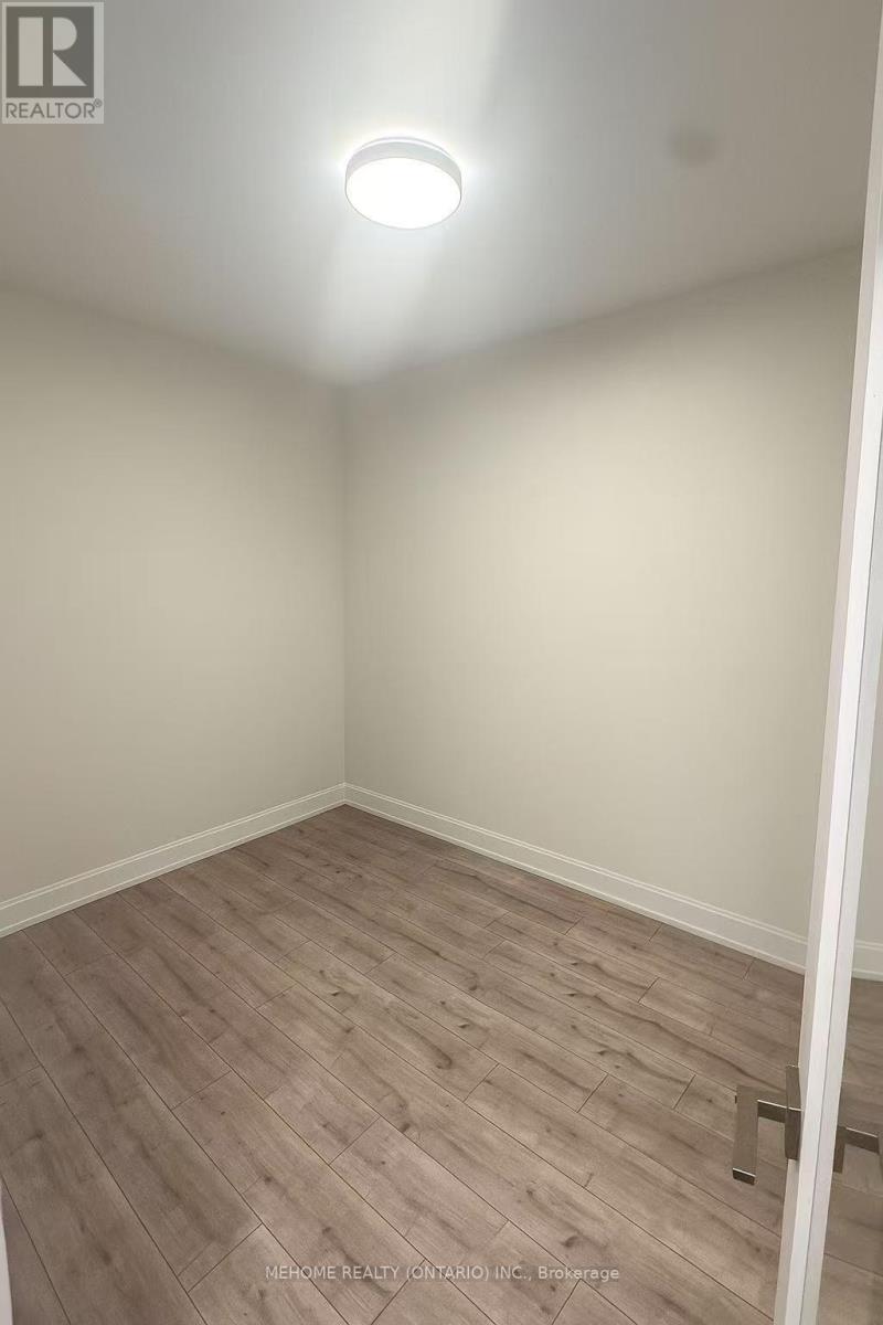 606 - 18 Water Walk Drive, Markham, Ontario  L3R 6L5 - Photo 6 - N12475169