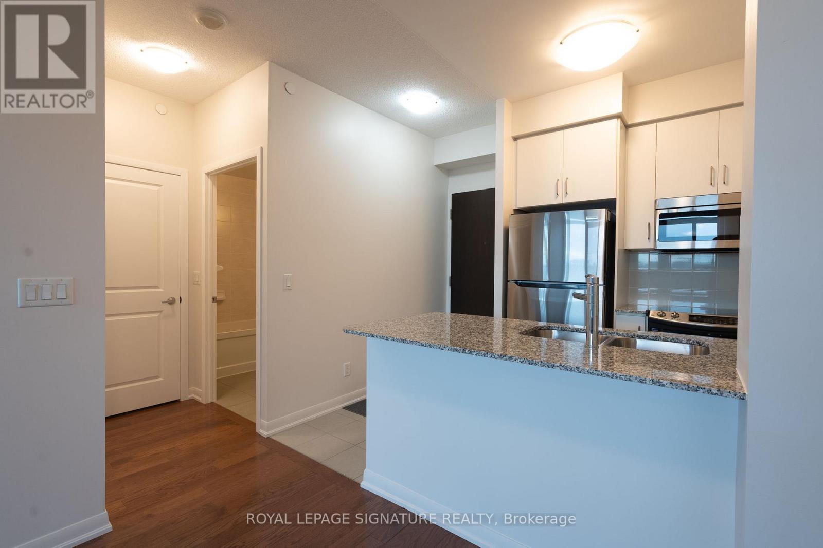 409 - 215 Sherway Gardens Road, Toronto, Ontario  M9C 0A4 - Photo 2 - W12475542
