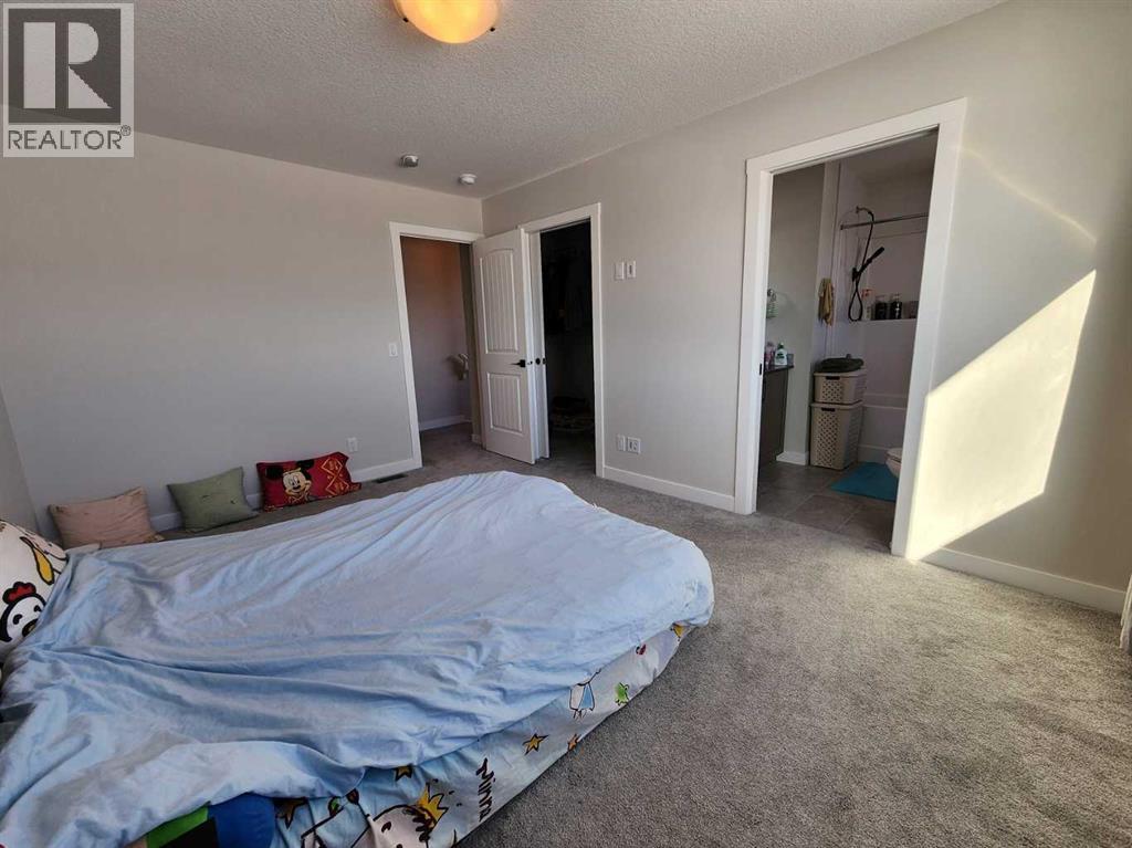 99 Edith Passage Nw, Calgary, Alberta  T3R 2B5 - Photo 24 - A2226472