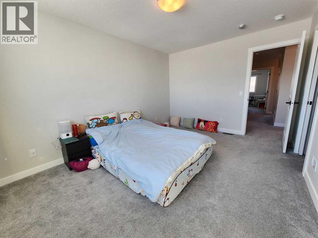 99 Edith Passage Nw, Calgary, Alberta  T3R 2B5 - Photo 25 - A2226472