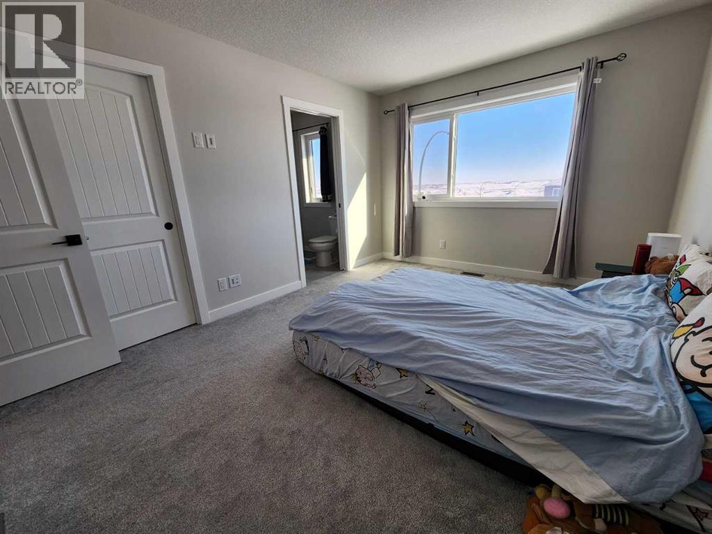 99 Edith Passage Nw, Calgary, Alberta  T3R 2B5 - Photo 23 - A2226472