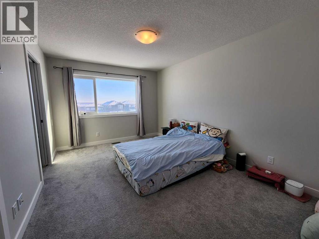 99 Edith Passage Nw, Calgary, Alberta  T3R 2B5 - Photo 22 - A2226472