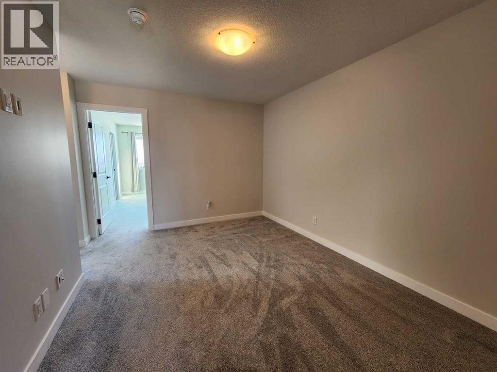 99 Edith Passage Nw, Calgary, Alberta  T3R 2B5 - Photo 30 - A2226472