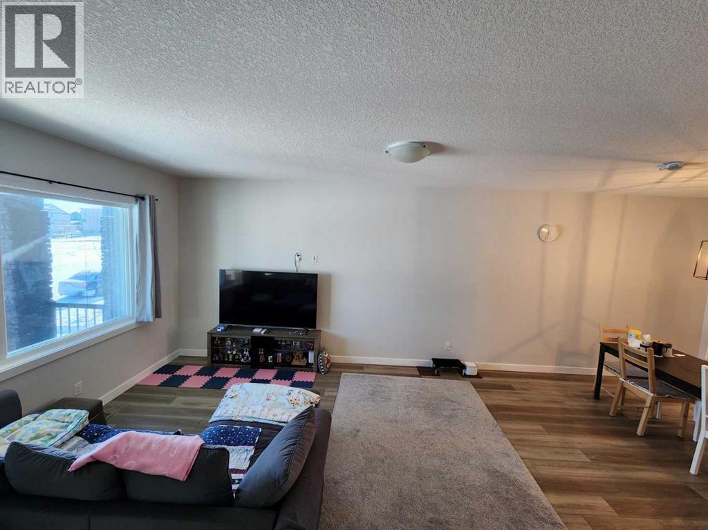 99 Edith Passage Nw, Calgary, Alberta  T3R 2B5 - Photo 4 - A2226472