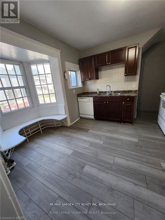 1 - 323 Queenston Street, St. Catharines, Ontario L2P 2X7 - Photo 6 - X12476446