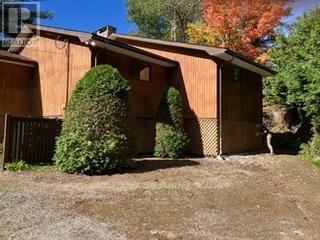 Welcome to this beautiful waterfront property on Sparrow Lake with 170 feet of favoured southwestern exposure. This seasonal cottage has been lovingly maintained by the same family for 40 years and pride of ownership is evident throughout. The shoreline is smooth sloping rock and has several paths down to the water's edge. The one boundary is identified with an engineered retaining wall with the neighbouring property being elevated and creating fantastic privacy. The other lot line abuts a back lot access to Sparrow Lake allowing use for 5 cottages on Goldfinch Court. The 3 bedroom, one bathroom design is not your typical layout with large bedrooms, generous closets, large great room and was designed by the original owner, an Architect. The primary bedroom has a walkout sliding glass door to the wrap around decking that is currently in need of replacement. The great room boasts soaring cedar ceilings And a floor to ceiling stone fireplace making it a cottage dream in Muskoka!  The varied layout allows for lots of windows allowing for lots of natural light. The current owners have nurtured beautiful gardens on the property from the lake all the way to the municipally maintained year round road. The concrete perimeter wall foundation is open on the lakeside allowing for storage for all the toys. Book your private walk though today and see for yourself! (id:48254)