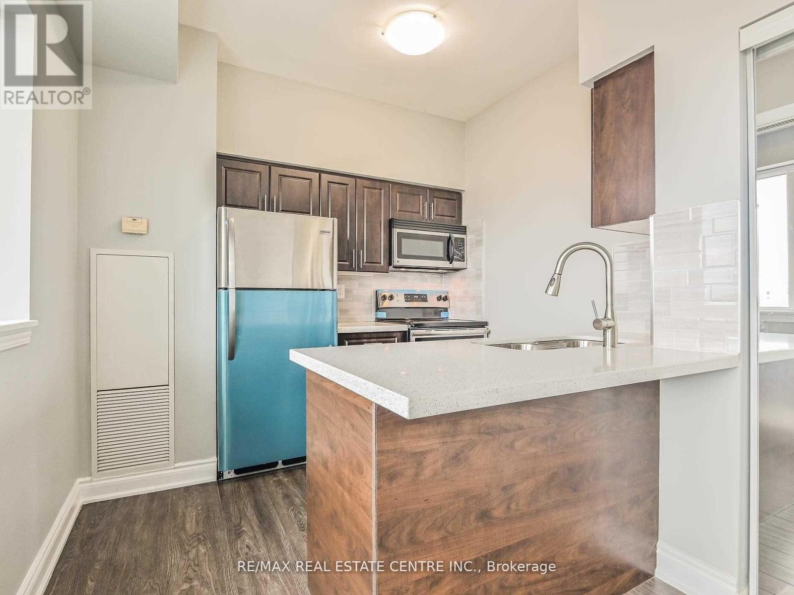 301 - 215 Queen Street E, Brampton, Ontario  L6W 0A9 - Photo 12 - W12477614