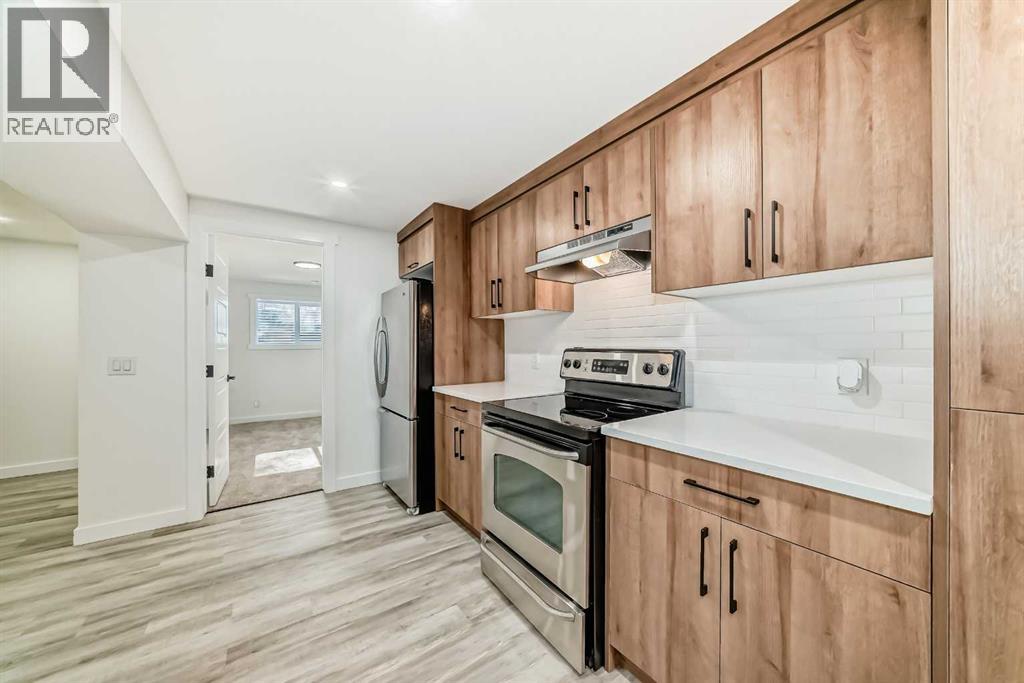 946 Berkley Drive Nw, Calgary, Alberta  T3K 1A2 - Photo 32 - A2264876