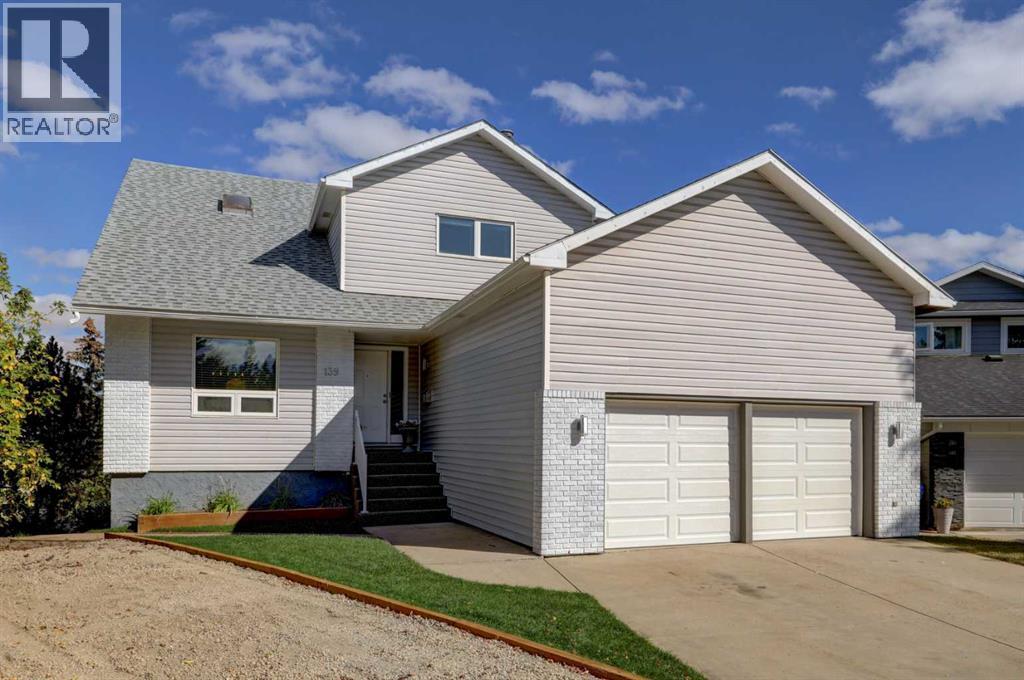 139 Berkshire Place Nw, Calgary, Alberta  T3K 1Z7 - Photo 1 - A2259356
