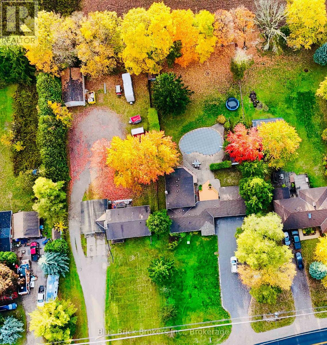 Rare In Rarest. Come and enjoy the Cottage/ Country style living heart of the city. Total living area of over 3750 Sq. ft will blow your heart. Chefs dream kitchen with high end appliances a large pantry and stunning eat at island with granite, this is open to a large dining space, and perfect for family dinners. The main floor has in law suite capabilities, with a bedroom and a large 5 piece bathroom. Upstairs you will find three large bedrooms and a nicely appointed 4 piece bath. The primary bedroom has an updated ensuite, his and hers closets as well as a substantial balcony looking over the back yard. The lower level at the back has an enormous family room, that has more that enough room for all the family to gather with its cozy gas insert fireplace and windows. There is also a lower level that can used as a bedroom/Livingroom or games room. There is loads of storage through out this home including the oversized mudroom to catch all all the kiddos things. There is also an oversized double car garage and parking for 15 plus cars outside. The lot is 100-280 feet and the back yard oasis has in ground heated fox pool, concrete patio and tiered decking, ample green space for kids play area and is fully fenced. There is also a pool shed and a garden shed with hydro that would make a great "She Shed or Man Cave". It feels like living in the country with the open space in the back yard, yet so close to the amenities of the city (id:48254)