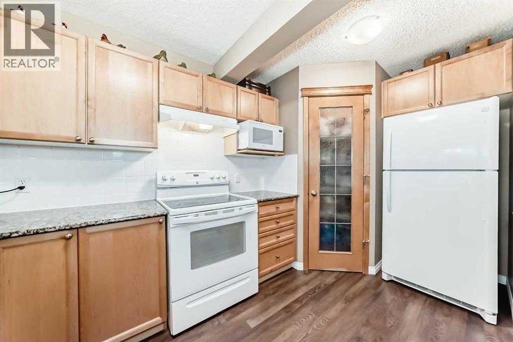 66 Cougar Ridge Circle Sw, Calgary, Alberta  T3H 5C8 - Photo 5 - A2259579