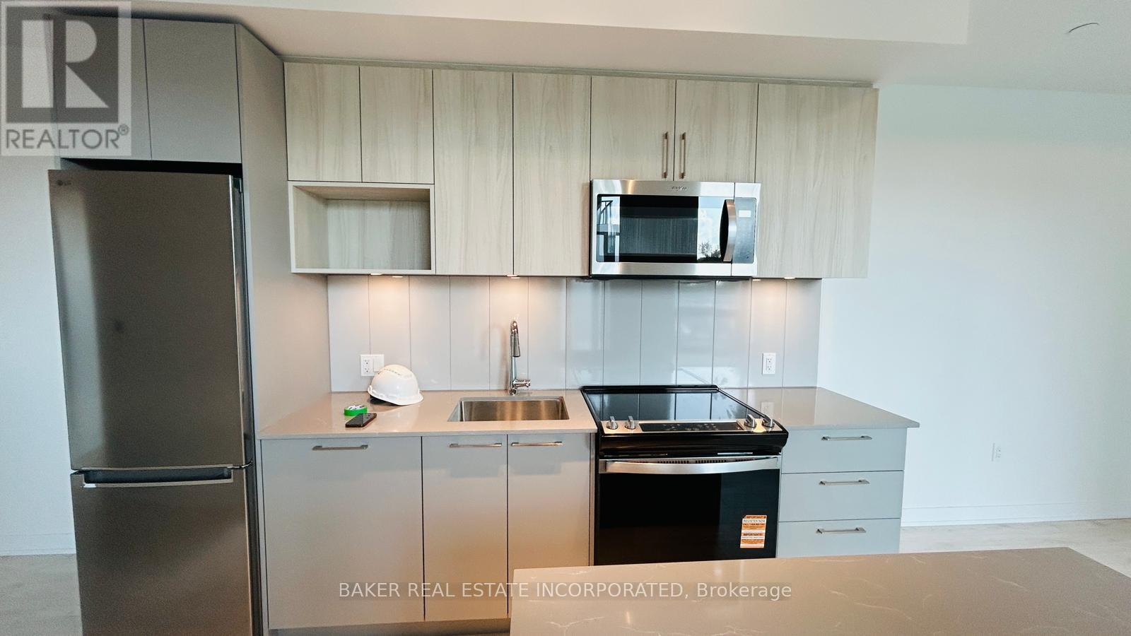 201 - 500 Plains Road E, Burlington, Ontario  L7T 2E1 - Photo 2 - W12481097