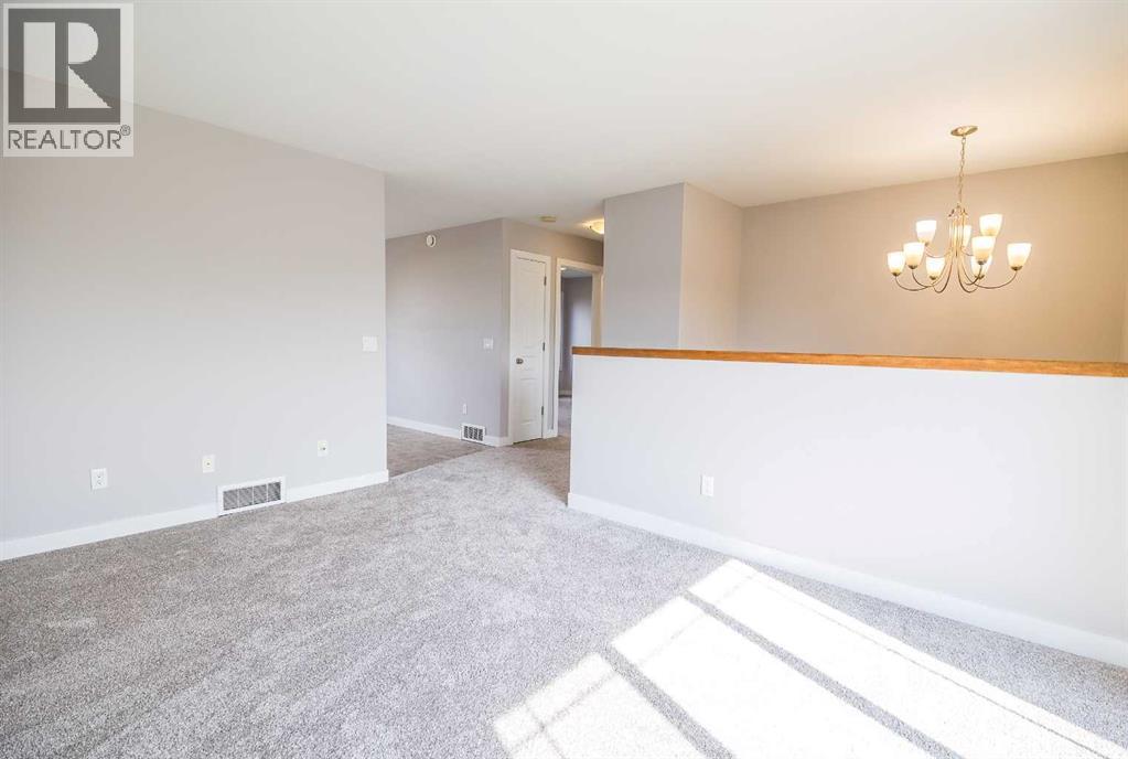 146 Newton Drive, Penhold, Alberta  T0M 1R0 - Photo 3 - A2257366