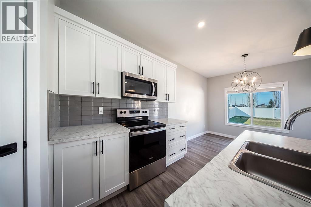 88 Henderson Crescent, Penhold, Alberta  T0M 1R0 - Photo 7 - A2265156