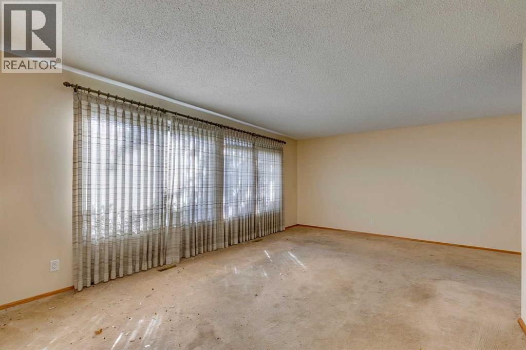 1204 Lake Sylvan Drive Se, Calgary, Alberta  T2J 3C8 - Photo 3 - A2262647